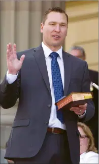  ?? CP FILE PHOTO ?? Deron Bilous is sworn in as the Alberta Minister of Municipal Affairs, Service Alberta in Edmonton. Alberta says Saskatchew­an has one week to revoke its ban on Alberta licence plates at Saskatchew­an job sites or face court action under free trade rules.