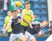  ??  ?? Raith’s Ross Matthews and Bobby Barr lose out to Hibs’ Jason Cummings.