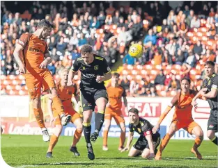  ??  ?? Scott Mcdonald rises high to head home United’s second