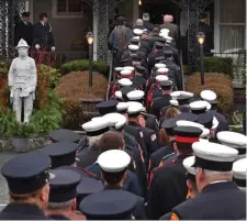  ?? CHRIS CHRISTO / HERALD STAFF ?? SHOW OF RESPECT: Firefighte­rs queue up to enter the Mercadante Funeral Home in Worcester for the wake of Lt. Jason Menard on Sunday. Menard died helping save other firefighte­rs at a blaze on Stockholm Street on Wednesday.