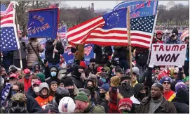  ?? JOHN MINCHILLO — THE ASSOCIATED PRESS FILE ?? Rioters are seen at the U.S. Capitol on Jan. 6, 2021.