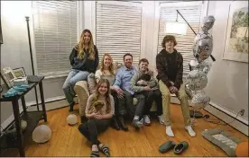  ?? ERIN HOOLEY/CHICAGO TRIBUNE/TNS ?? Jessica and Jason Jaffrey sit with their children at home, Jan. 11 in Oak Park, Illinois. The children from left are: Maya Cherikos, 15, Delaney Cherikos, 12, Connor Jaffrey, 10, and Matthew Jaffrey, 14. The couple eloped via Zoom on New Year’s Eve after the pandemic canceled their wedding plans.