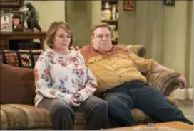  ?? ADAM ROSE — ABC VIA AP ?? In this image released by ABC, Roseanne Barr, left, and John Goodman appear in a scene from the reboot of “Roseanne.”