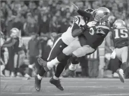  ?? ASSOCIATED PRESS FILE PHOTO ?? Houston Texans defensive end Jadeveon Clowney levels New England Patriots quarterbac­k Tom Bradydurin­g the first half of their NFL divisional playoff game Jan. 14.