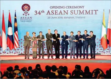  ?? TANG CHHIN SOTHY/AFP ?? Prime Minister Hun Sen (third right) poses with other Asean leaders at the Asean summit in Bangkok in June.