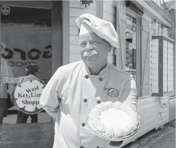  ?? GWEN FILOSA FLKeysNews.com ?? Top, Key West Mayor Teri Johnston with Kermit Carpenter. Above, Carpenter poses outside his shop in downtown Key West, where he’s been for 30 years.