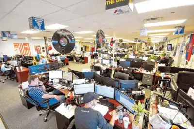  ?? STAFF PHOTOS BY TIM BARBER ?? Freight brokers display their ongoing achievemen­ts with record albums above their desks at Avenger Logistics.