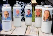  ?? KARL MERTON FERRON / BALTIMORE SUN ?? Candles bearing the faces of the fifive slain Annapolis Capital Gazette employees — Gerald Fischman, Rob Hiassen, John McNamara, Rebecca Smith and Wendi Winters — sit at a vigil last month at the Annapolis Mall. A 38-year-old man has been charged with...