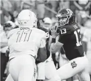  ??  ?? Aggies QB Haynes King struggled at times in his first start, throwing three intercepti­ons.