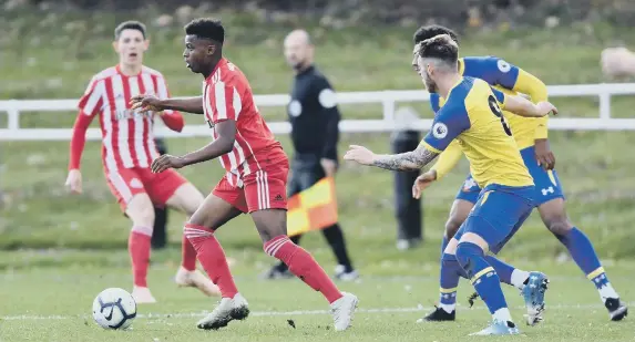  ??  ?? Bali Mumba takes the ball forward at Hetton yesterday.