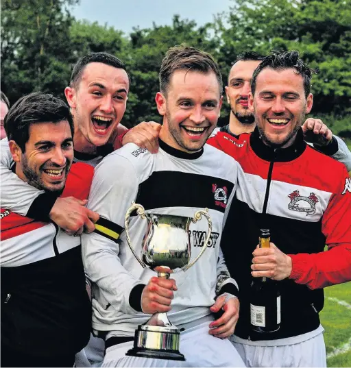  ??  ?? Pontypridd Town were presented with the Welsh Football League Division Three trophy after the Bridgend Street match