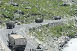  ?? WASEEM ANDRABI/HT PHOTO ?? A convoy of the Indian Army moves along a highway in Ganderbal of Jammu and Kashmir on its way to n
Ladakh, on June 17, following a face-off with the PLA.