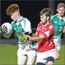  ??  ?? Peter O’Leary of Crossabeg-Ballymurn under pressure from Oisín Rooney (Moguegeen Gaels).