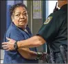  ?? LANNIS WATERS / THE PALM BEACH POST ?? Delia Torres appears in a courtroom at the county jail Wednesday. She is charged with aggravated battery.