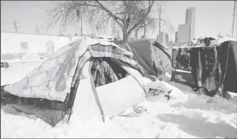  ??  ?? A man camping out in the snow (Reuters photo)