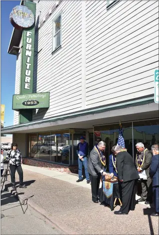  ?? MARY BULLWINKEL - FOR THE TIMES-STANDARD ?? A small crowd gathered at Ninth and Main streets in Fortuna on March 27when what is commonly referred to as the Low’s Furniture building was designated the oldest commercial building still standing in the city by the Native Sons of the Golden West.