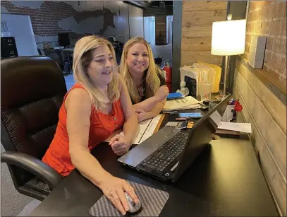  ?? PHOTOS BY KYRA GOTTESMAN/MERCURY-REGISTER ?? Hope Center CFO Jennifer Alpern, left, works with office manager Haley Kingery at the nonprofit’s downtown business office Wednesday in Oroville.