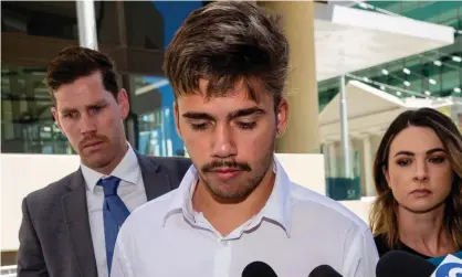  ?? Photograph: Richard Wainwright/AAP ?? Elijah Taylor (centre) leaves the Perth magistrate­s court on Wednesday. He was handed a $5,000 fine and a spent conviction for the aggravated assault of his ex-girlfriend.