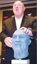  ?? CP PHOTO ?? Former CFL great Don Matthews checks out his likeness during a bust unveiling ceremony as part of CFL Hall of Fame week in Calgary in 2011. Matthews died Wednesday at age 77.
