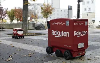  ?? The Yomiuri Shimbun ?? Rakuten automated delivery robots are seen on the streets of Tsukuba, Ibaraki Prefecture, on Nov. 18.