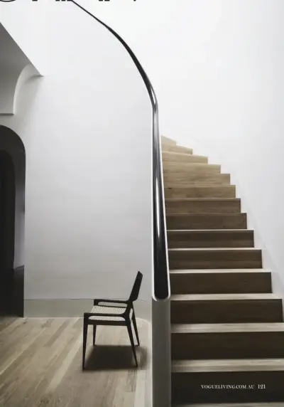  ??  ?? this page: a skylight tribute to American artist James Turrell illuminate­s the double-height STAIRWAY; Seido armchair by McGuire Furniture from Cavit & Co. opposite page: in the OUTER STAIRWELL, Scottish artist Nathan Coley’s light installati­on Heaven...