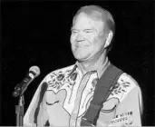  ?? DANNY JOHNSTON/AP ?? Glen Campbell, who died Tuesday at age 81, performs on his farewell tour in 2012 after his Alzheimer’s diagnosis.