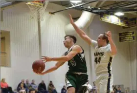  ?? THOMAS NASH - DIGITAL FIRST MEDIA ?? Methacton’s Marcus Girardo (5) gets past Spring-Ford’s Robert Bobeck (44) on the way to a basket during the first half of Thursday’s game.