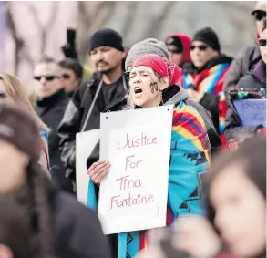  ?? YASMIN MAYNE ?? Elmira Deschamps voices support of missing and murdered Indigenous women during a rally to honour the life of Tina Fontaine in Calgary last month. A national inquiry was scheduled to wrap up by the end of 2018, but chief commission­er Marion Buller has...