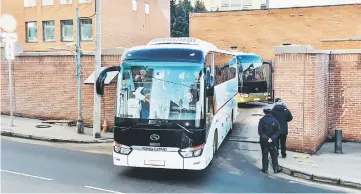  ??  ?? Buses with US diplomats and their families who have been expelled from Russia leave the American Embassy compound in Moscow.