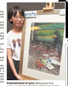  ??  ?? Entertainm­ent of yore: Watercolou­r first runner-up Tan Siew San from USM displaying her piece ‘ The forgotten games’ at the art competitio­n.