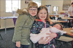  ?? 08_a48coffemo­rning02 ?? Ella and Millie Fyfe, aged six and eight, with their baby sister and youngest coffee morning attendee, seven-week-old Pippa.