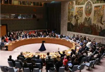  ?? XINHUA/VNA Photo ?? Representa­tives vote on a draft resolution during a Security Council meeting at the UN headquarte­rs in New York, on Monday. The Security Council on Monday adopted a resolution that demands an immediate cease-fire in Gaza for the holy month of Ramadan.