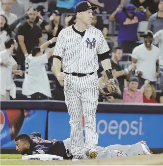  ?? AP PHOTO ?? REAL DOWNER: Eduardo Nunez reacts on the ground after being tagged out by the Yankees’ Todd Frazier trying to advance to third on a fly ball in the ninth inning of the Red Sox’ 5-4 loss last night in New York.