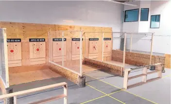  ?? COURTESY OF THE BATTLE AXE EOOM ?? Albuquerqu­e ax-throwing enthusiast­s now have a venue to practice their moves in what is called a fast-growing sport.
