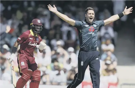  ??  ?? England’s Chris Woakes unsuccessf­ully appeals for the wicket of West Indies’ John Campbell.