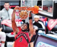  ?? JULIO AGUILAR GETTY IMAGES FILE PHOTO ?? Toronto’s OG Anunoby dunks against the New Orleans Pelicans at Amalie Arena in Tampa, Fla., in December. The Raptors will play all their home games in Tampa this season due to the COVID-19 pandemic.