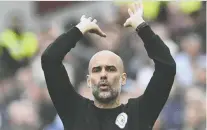  ?? JUSTIN TALLIS/AFP VIA GETTY IMAGES ?? Manchester City's manager Pep Guardiola could capture his fourth Premier League trophy this weekend if his side can defeat Aston Villa.