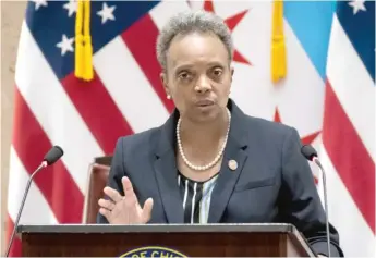  ?? ASHLEE REZIN GARCIA/ SUN- TIMES ?? Mayor Lori Lightfoot delivers her 2021 budget address in October at City Hall.