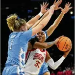  ?? AP ?? Ohio State forward Cotie McMahon looks to shoot in the second half of Monday’s game against North Carolina. “I want to play UConn so bad,” she said after the Buckeyes’ win. “Before the season even started. UConn.” She’ll get her wish Saturday.