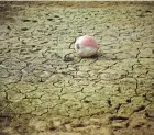  ?? SARAH MEYSSONNIE­R/REUTERS FILE ?? A buoy is seen on the banks of the partially dry Lake Montbel at the foot of the Pyrenees Mountains in France during a record winter dry spell in March 2023.