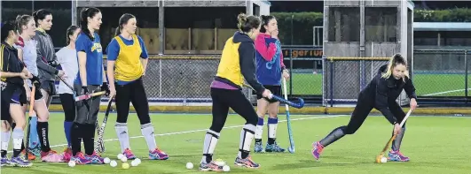  ?? PHOTO: GREGOR RICHARDSON ?? Training hard . . . Southern Storm’s Emily McNaughtan pushes the ball forward, with team mates Alice Sharples (left) and Sarah Thomas in support, as the team trains at the McMillan Centre this week.