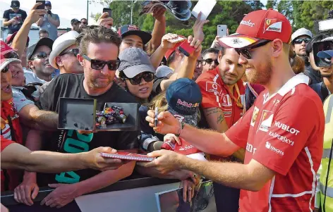  ?? FOTO: WEST/AFP ?? Trotz einer schwachen Saison 2016 ist Ferrari-Pilot Sebastian Vettel (rechts) gefragt wie nie.