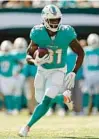  ?? ADAM HUNGER/AP ?? Miami Dolphins running back Raheem Mostert runs with the ball during an Oct. 9 game against the New York Jets in East Rutherford, N.J.