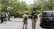  ?? Ap ?? RESPONDING TO THE CALL: Austin police, SWAT and medical personnel respond to an active shooter situation in Austin, Texas, on Sunday.