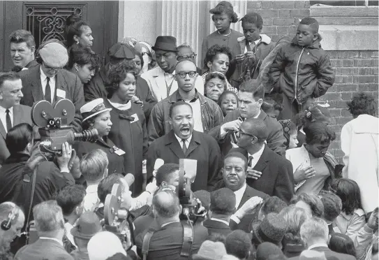  ?? AP FILE PHOTO ?? HE HAD A DREAM: Dr. Martin Luther King Jr. addresses a small crowd outside the William Boardman School in Roxbury on April 22, 1965.