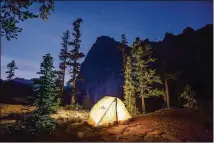  ?? COURTESY OF IDAHO TOURISM ?? A camping tent on Elephant’s Perch in the Central Idaho Dark Sky Reserve.