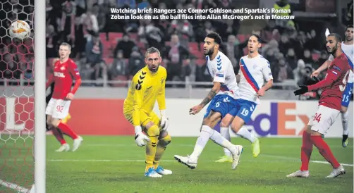  ??  ?? Watching brief: Rangers ace Connor Goldson and Spartak’s Roman Zobnin look on as the ball flies into Allan McGregor’s net in Moscow