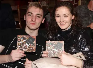  ??  ?? Kyle Goggins and Hayley Crosbie at the launch with their copies of the CD.