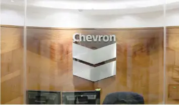  ?? — Reuters ?? The logo of Chevron is seen at the company’s office in Caracas, Venezuela.