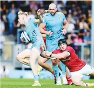  ??  ?? Away: Exeter’s Josh Hodge breaks a tackle